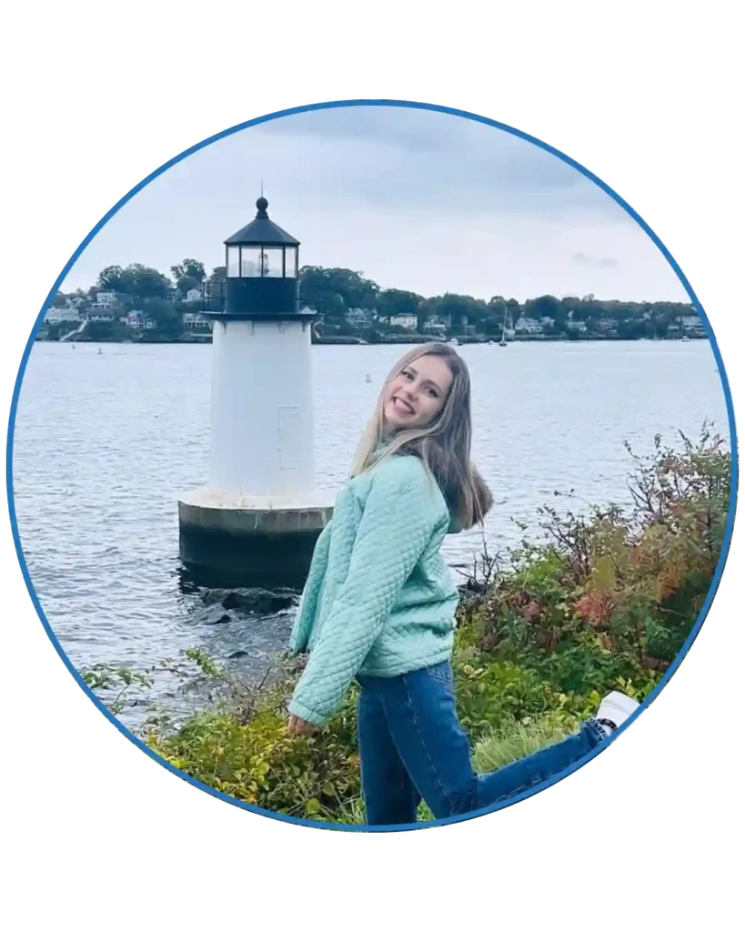 a picture of a girl standing in front of a lighthouse